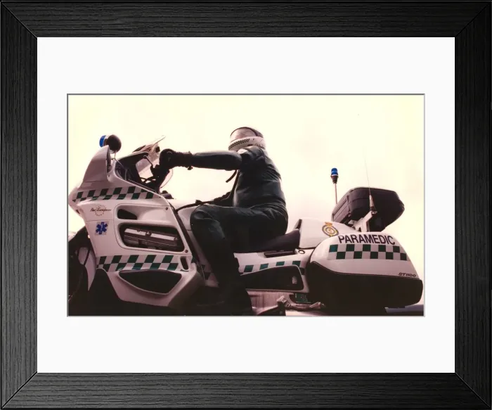 Framed Print : A paramedic on a motorcycle ready for the next call Framed Print : A paramedic on a motorcycle ready for the next call