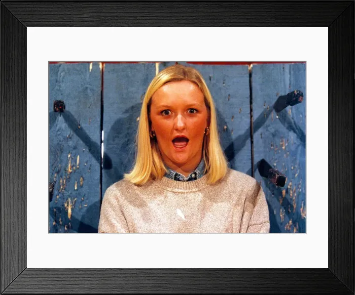 Framed Print : Louise Jones, 22, who won the auditions for the job as a knife throwers assistant with