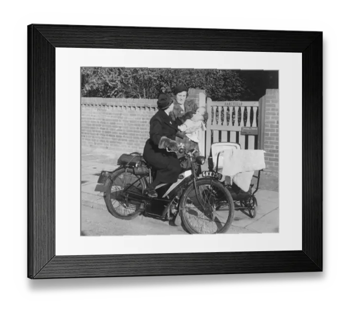 Framed Print : A mother stops district nurse Lily Rands on her bicycle to seek advice for her little