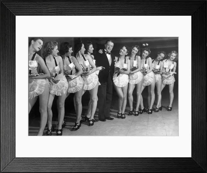 Framed Print : Comedian Tommy Handley stands with a line up of modern girl secretaries at Jack