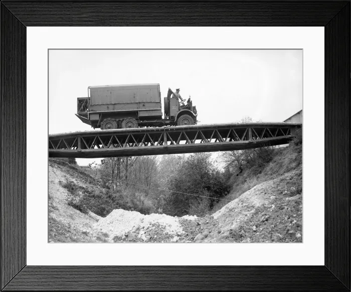 Framed Print : British army soldiers crossing over a bailey bridge in a truck during training exercises Framed Print : British army soldiers crossing over a bailey bridge in a truck during training exercises