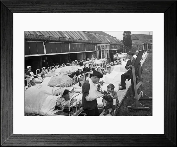 Framed Print : Corporal Paddick of the Royal Air Forcee in arm bandage and Officer Hooper Framed Print : Corporal Paddick of the Royal Air Forcee in arm bandage and Officer Hooper