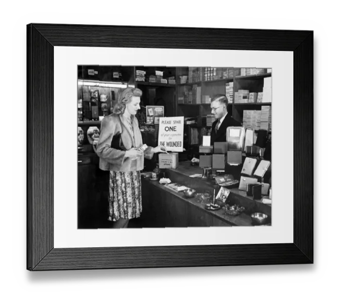 Framed Print : A woman buying a packet of cigarettes in a tobacconist shopin London Framed Print : A woman buying a packet of cigarettes in a tobacconist shopin London