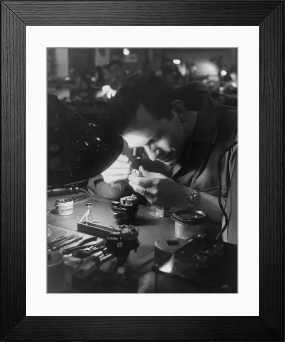 Framed Print : An American soldier of the Eighth Air Force mending part of a gyroscope for use on board Framed Print : An American soldier of the Eighth Air Force mending part of a gyroscope for use on board