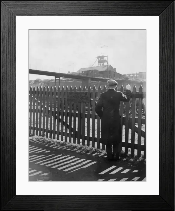 Framed Print : A miner looks over the fence toward the Gorkie Colliery during the miners strike in World
