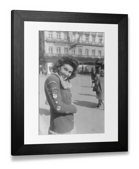 Framed Print : A Brussels girl whose hobby is collecting badges from the liberating Allied troops Framed Print : A Brussels girl whose hobby is collecting badges from the liberating Allied troops