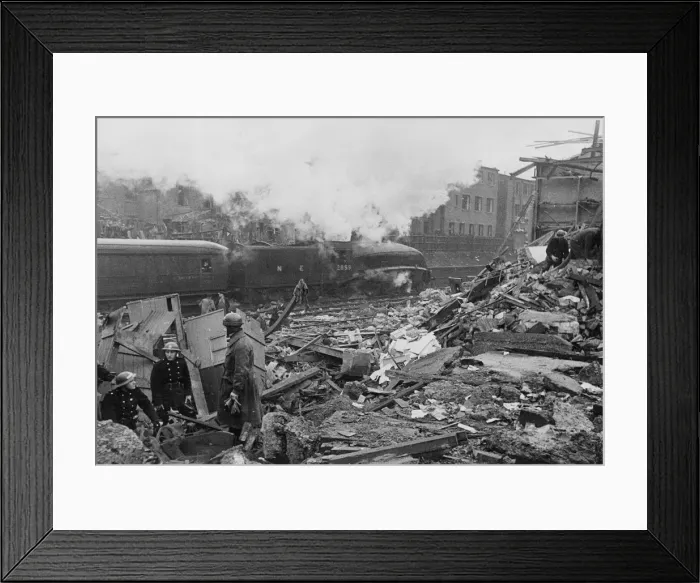 Framed Print : Dispatch bike riders glumly sit around the totally obliterated National Fire Service