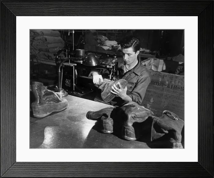 Framed Print : An American soldier mending a pair of boots for air men of the USaF Eighth Army at a Framed Print : An American soldier mending a pair of boots for air men of the USaF Eighth Army at a