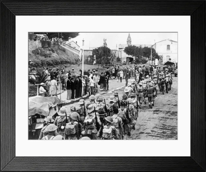 Framed Print : Men from a Scottish regiment marching through the town of Asmara Framed Print : Men from a Scottish regiment marching through the town of Asmara