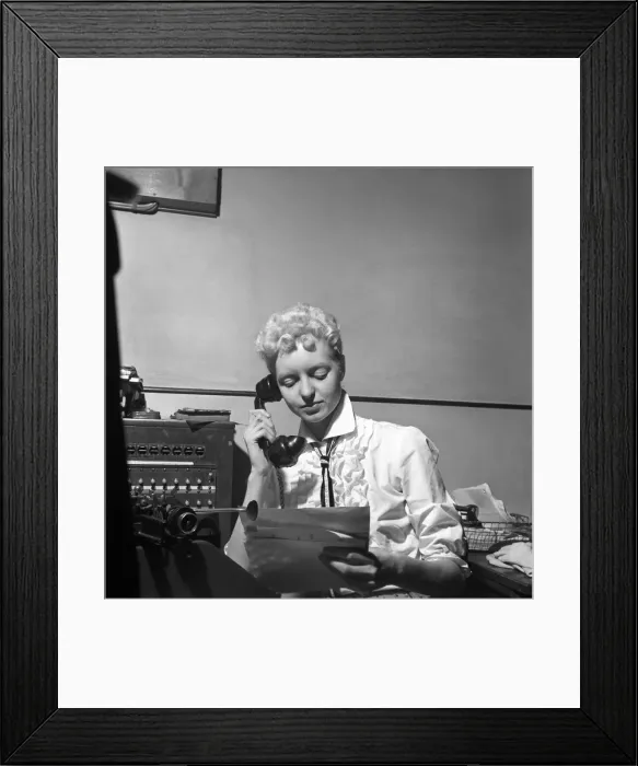 Framed Print : General office scene: Secretary taking notes and answering the phone in a Birmingham Framed Print : General office scene: Secretary taking notes and answering the phone in a Birmingham