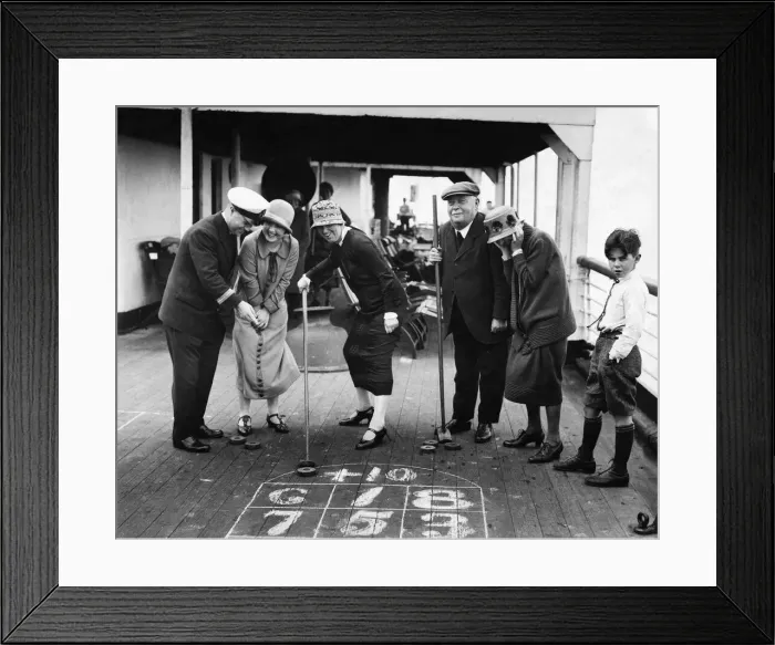 Framed Print : The Purser of the Minnekhada shows our prizewinners how to play Deck Golf Framed Print : The Purser of the Minnekhada shows our prizewinners how to play Deck Golf