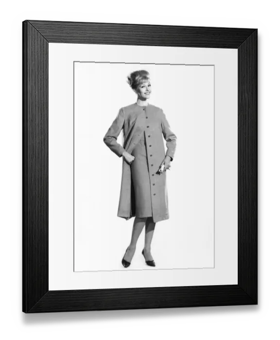 Framed Print : Woman wearing long buttoned coat and dress. Reveille Fashions. Jo Waning Framed Print : Woman wearing long buttoned coat and dress. Reveille Fashions. Jo Waning