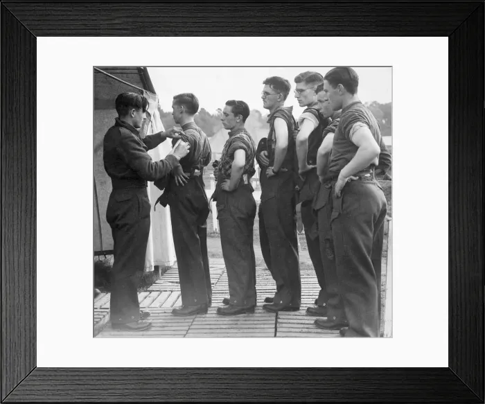 Framed Print : New army recruits wait in line with their sleeves rolled up as they wait to be vaccinated