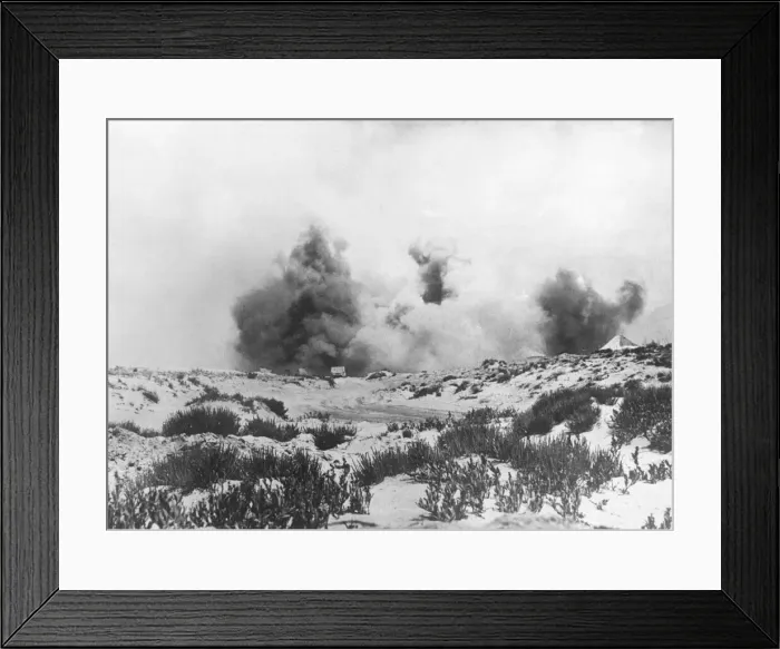 Framed Print : Bombs bursting on some disused sheds near South Africa brigade headquarters during