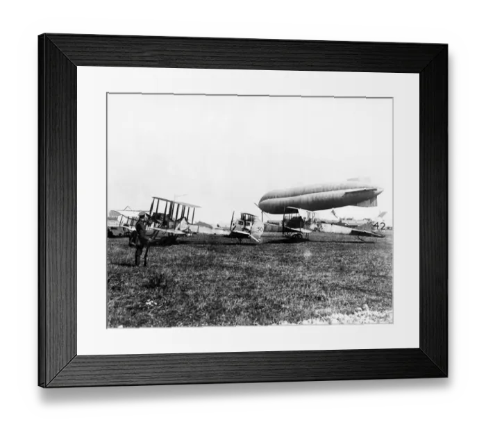 Framed Print : An airship guarding planes of the Royal Naval Air Service Eastchurch squadron near Ostend