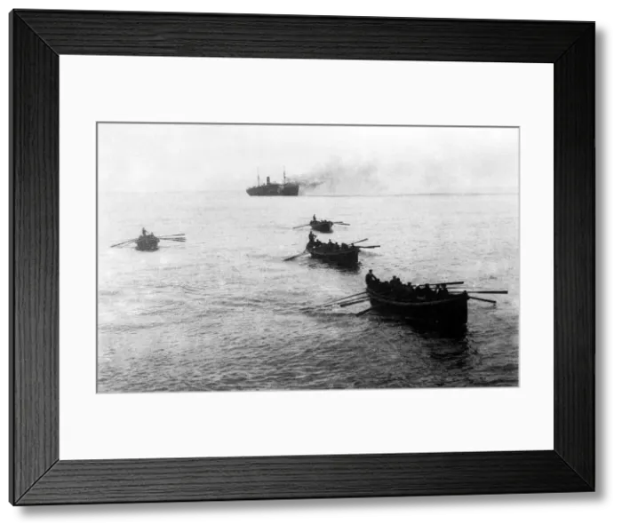 Framed Print : Crews of sunken German ships being rowed to a waiting English war vessel after coming Framed Print : Crews of sunken German ships being rowed to a waiting English war vessel after coming