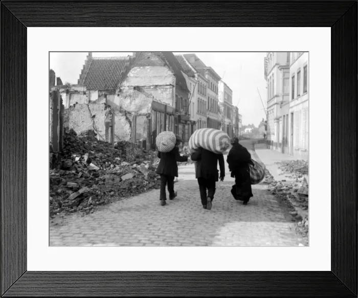 Framed Print : Refugees carry their belongings with them as they flee the fighting during the Battle of Framed Print : Refugees carry their belongings with them as they flee the fighting during the Battle of