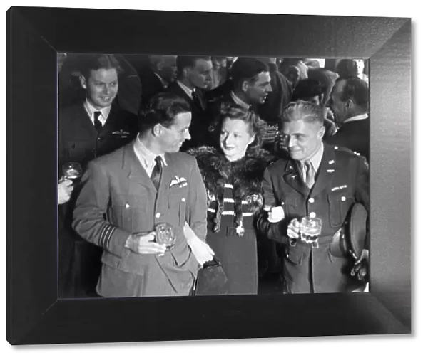 Dam Busters. Wing Commander Guy Gibson and Mrs Gibson talking with Captain W. K Clark, U