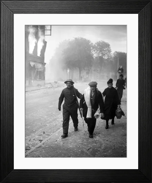 Framed Print : An English soldier helps some refugees through a burning town in Belgium following German Framed Print : An English soldier helps some refugees through a burning town in Belgium following German