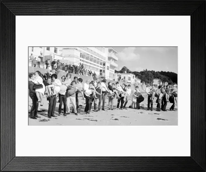 Framed Print : Honeymoon couples on the sunny Isle of Jersey. 140 couples gathered at St Brelades Bay Framed Print : Honeymoon couples on the sunny Isle of Jersey. 140 couples gathered at St Brelades Bay