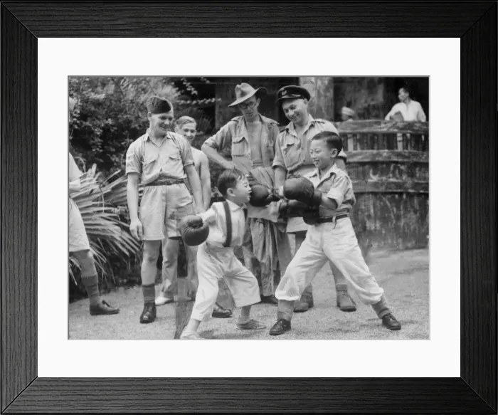 Framed Print : Chinese children taken under the wing of RAF officers having a boxing fight in Hong Kong