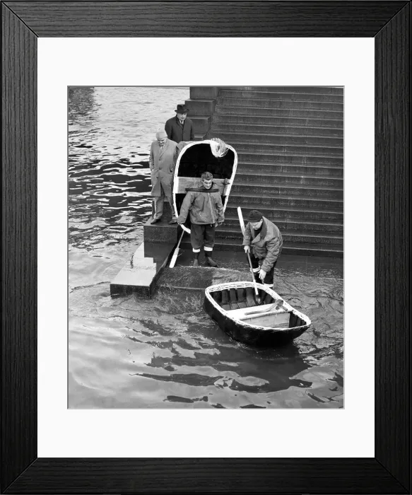 Framed Print : The Elias brothers putting their coracles into the River Thames at Festival Pier for a Framed Print : The Elias brothers putting their coracles into the River Thames at Festival Pier for a