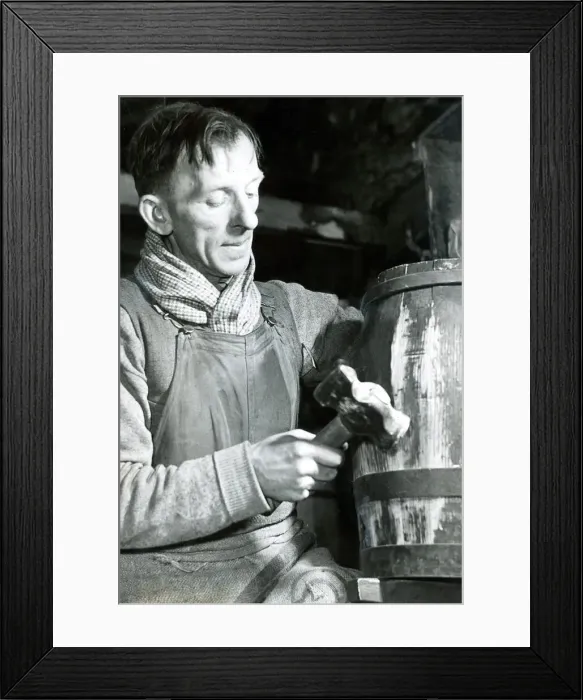 Framed Print : Mr. John parker, a cooper for 30 years, at work on a rum cask bound for one of Her Framed Print : Mr. John parker, a cooper for 30 years, at work on a rum cask bound for one of Her