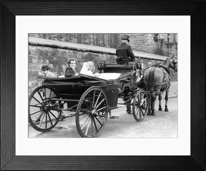 Framed Print : A young couple using a romantic form of transport, a horse and carriage for their wedding Framed Print : A young couple using a romantic form of transport, a horse and carriage for their wedding