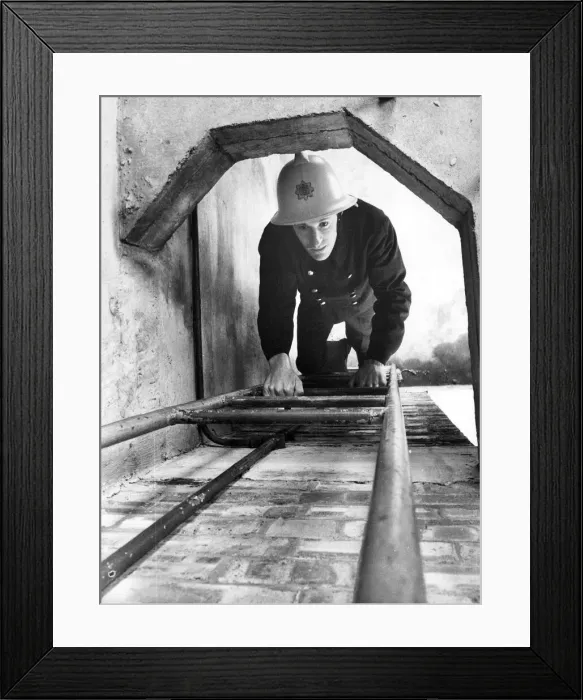 Framed Print : A firefighter climbs the ladder at the Morpeth drill tower where Northumberland Framed Print : A firefighter climbs the ladder at the Morpeth drill tower where Northumberland