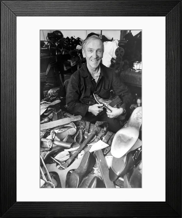 Framed Print : Cobbler Ernest Boyd who has been cobbling shoes since he was twelve Framed Print : Cobbler Ernest Boyd who has been cobbling shoes since he was twelve