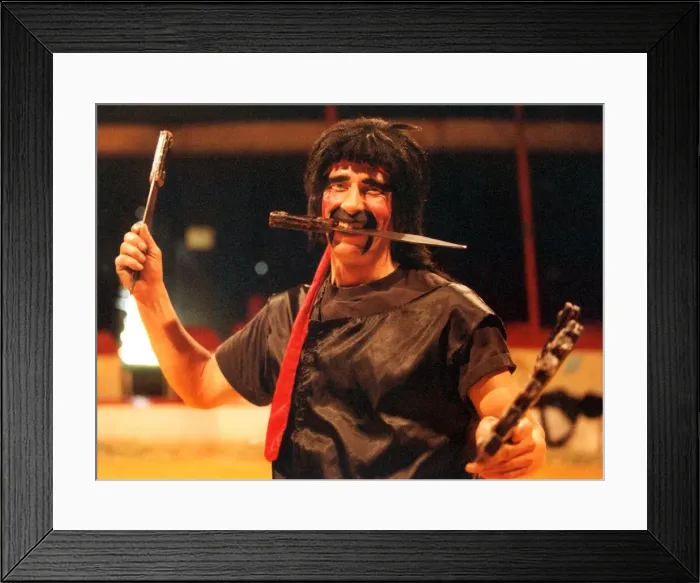 Framed Print : karl Orry of the Russian State Circus getting in some practice with his knives Framed Print : karl Orry of the Russian State Circus getting in some practice with his knives