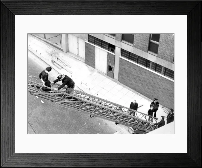 Framed Print : A young boy is rescued from a roof of a building in Pudding Chare, Newcastle Framed Print : A young boy is rescued from a roof of a building in Pudding Chare, Newcastle