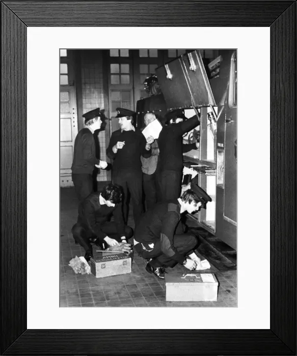 Framed Print : Firefighters check that their equipment on the fire engine is ready for action