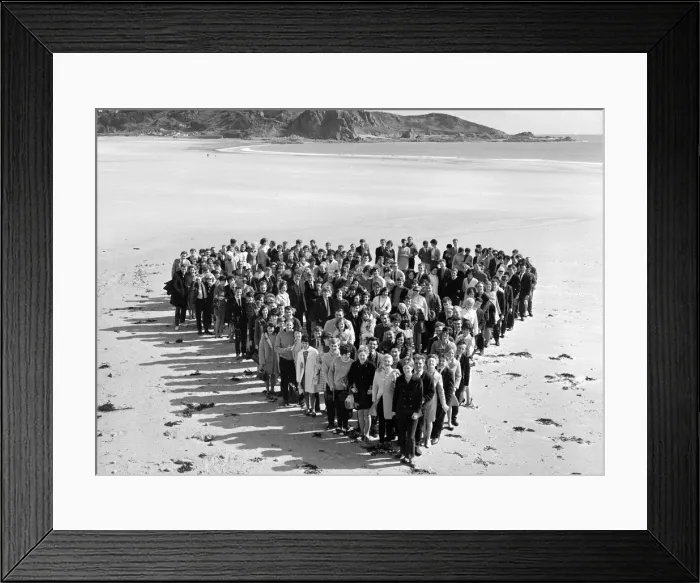 Framed Print : Honeymoon couples on the sunny Isle of Jersey. 140 couples gathered at St Brelades Bay Framed Print : Honeymoon couples on the sunny Isle of Jersey. 140 couples gathered at St Brelades Bay