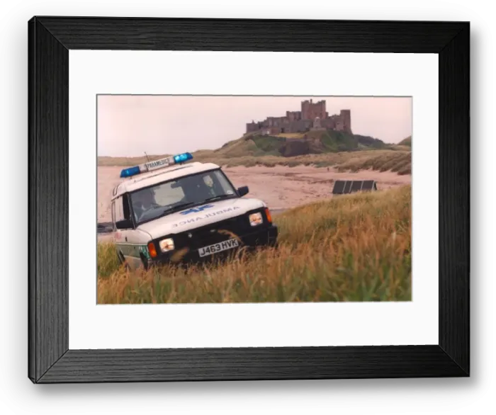 Framed Print : Beach combing - one of the new 4 wheel drive ambulances in action at Bamburgh Castle Framed Print : Beach combing - one of the new 4 wheel drive ambulances in action at Bamburgh Castle