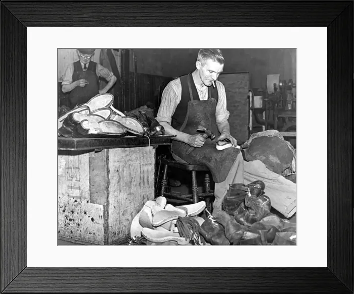 Framed Print : Clogs which save valuable leather are returning to favour among workers in heavy wqr