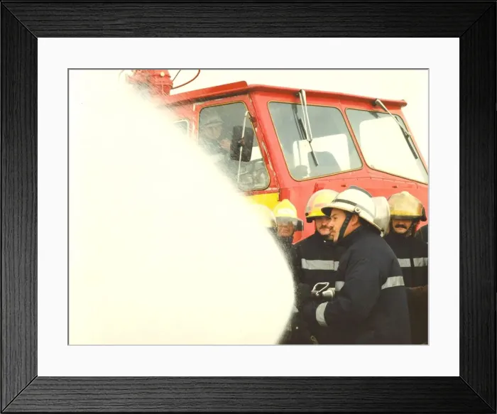 Framed Print : Firefighters practice rescue routines in a training exercise on the river