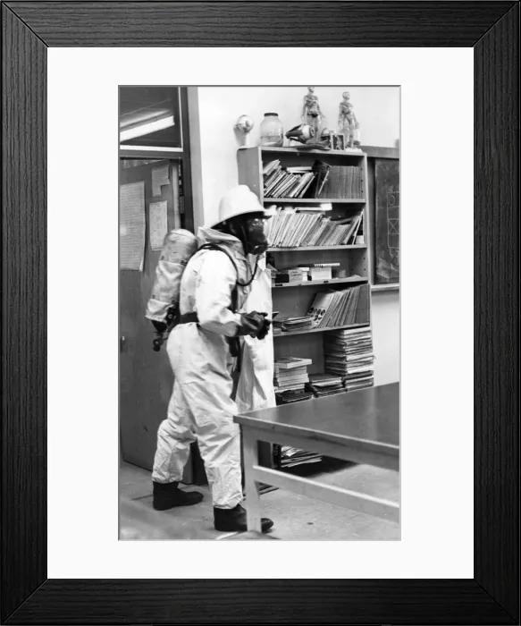 Framed Print : A firefighter checks the classroom is safe Framed Print : A firefighter checks the classroom is safe