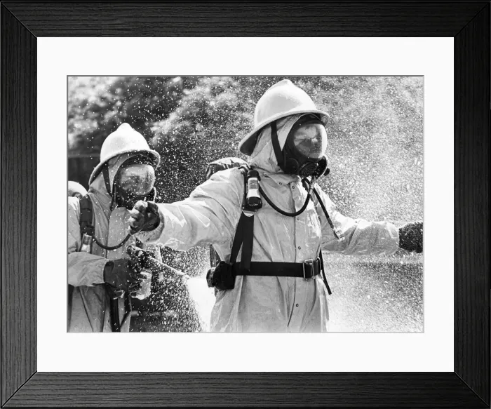 Framed Print : Firefighters wearing protective suits fought a blaze in an asbestos unit at Poter Limited Framed Print : Firefighters wearing protective suits fought a blaze in an asbestos unit at Poter Limited