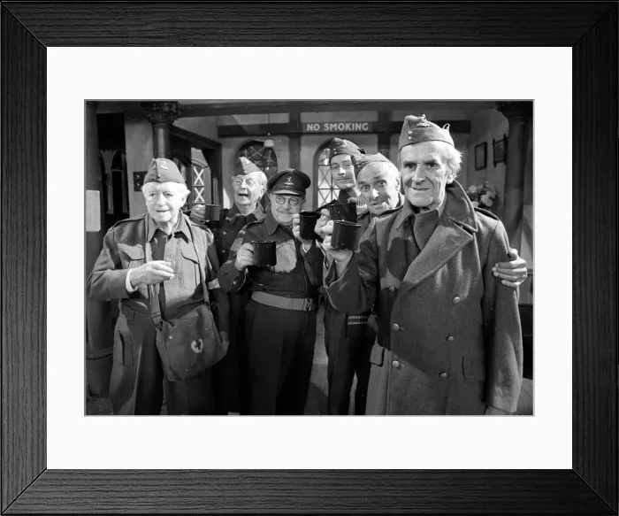 Framed Print : Stars of the popular wartime comedy television programme Dads Army toast each other after Framed Print : Stars of the popular wartime comedy television programme Dads Army toast each other after