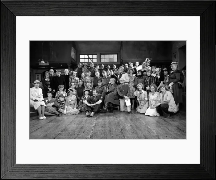 Framed Print : Stars of the popular wartime comedy television programme Dads Army toast pose for a group