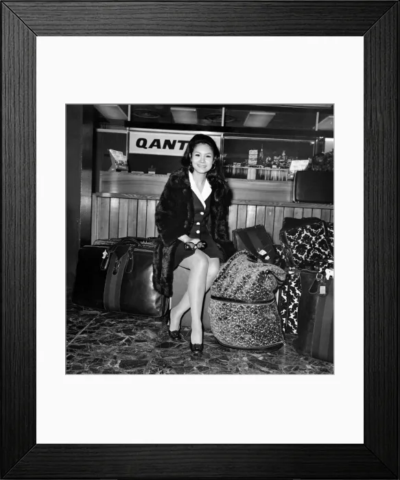 Framed Print : Entertainment. Film actors. Michael Caine left Heathrow with his Phillapino girl friend Framed Print : Entertainment. Film actors. Michael Caine left Heathrow with his Phillapino girl friend
