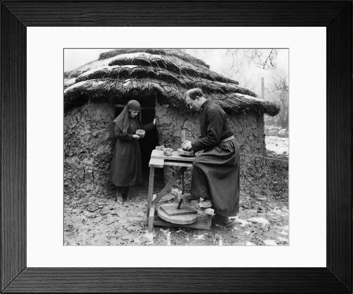 Framed Print : First Folk Park. Outside an early iron age hut in the village Framed Print : First Folk Park. Outside an early iron age hut in the village