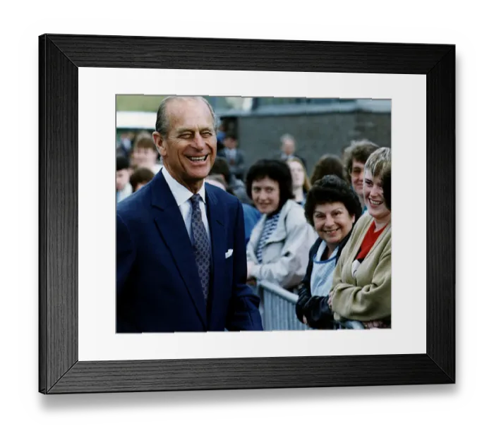 Framed Print : Prince Philip, Duke of Edinburgh, smiles as he talks to local woman on a walkabout in