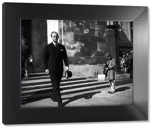 Prince Philip, Duke of Edinburgh, has his photo taken by girl as he leaves church