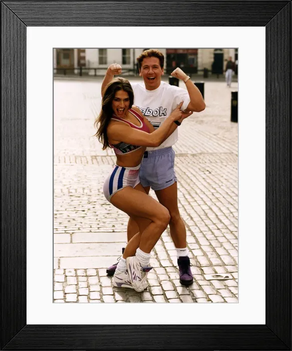 Framed Print : Ross King TV Presenter showing his muscles to Jet ( Gladiators ) Framed Print : Ross King TV Presenter showing his muscles to Jet ( Gladiators )