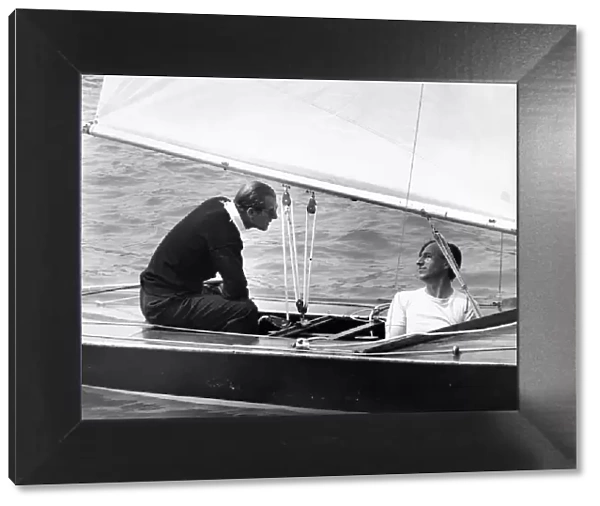 Prince Philip, Duke of Edinburgh, sails 'Coweslip at Cowes with crewman John Collis