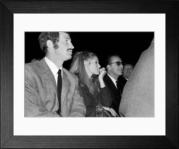Framed Print : Brian London v. Cassius Clay: Actress Ursula Andress watching the fight