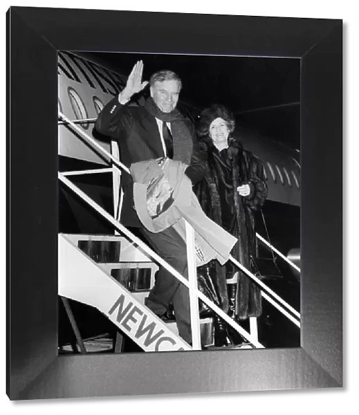 Charlton Heston arrives at Newcastle Airport, with his wife Lydia