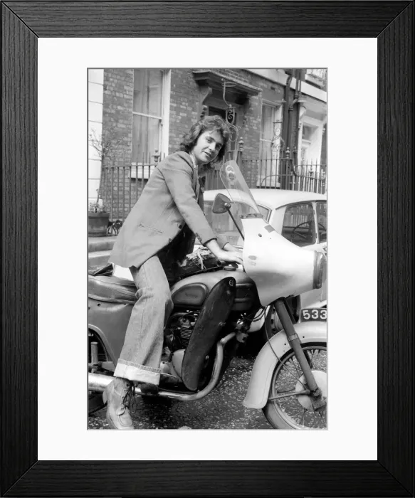 Framed Print : Singer David Essex seen here with a motor bike. July 1975 S75-3777
